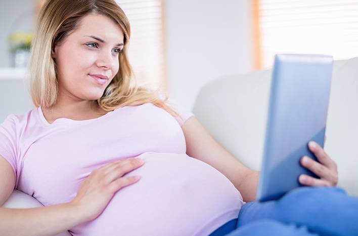 Pregnant Woman on iPad